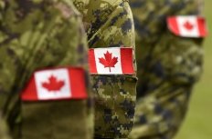 Canadian Soldiers with Flags on Arms