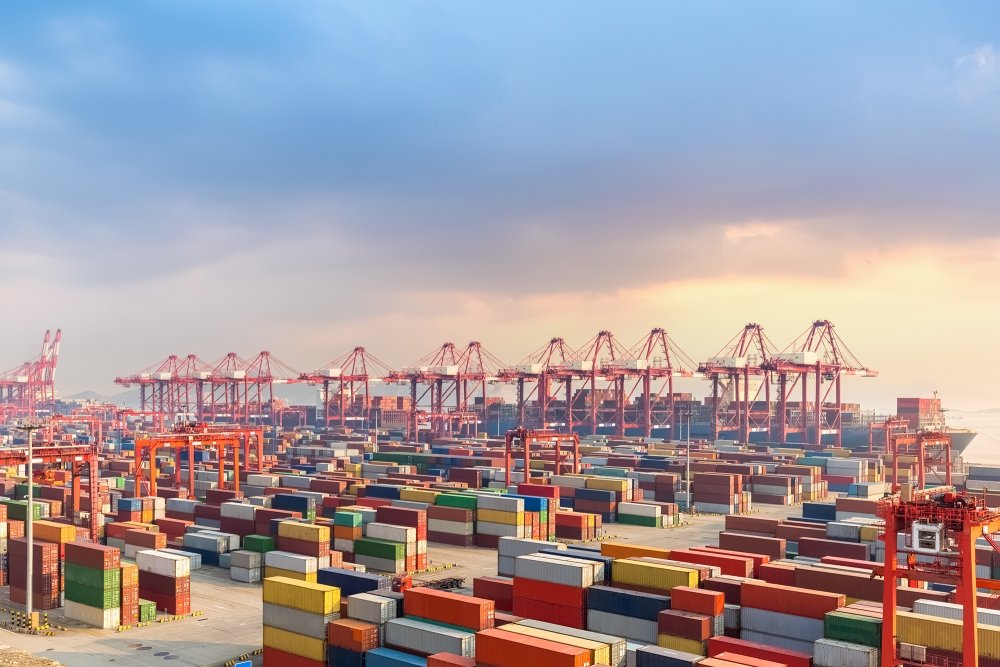 Image of the Shanghai port with shipping containers.
