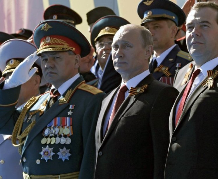 Sergey Shoigu, Vladimir Putin and Dmitry Medvedev at the military parade marking the 69th anniversary of Victory in the Great Patriotic War.