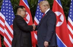 Trump Kim Summit U.S. President Donald Trump shakes hands with North Korea leader Kim Jong Un at the Capella resort on Sentosa Island Tuesday, June 12, 2018 in Singapore.