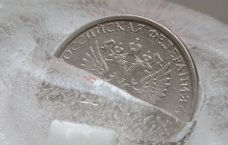 Russian coin frozen in ice block