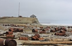 Rusty fuel and chemical drums in the Arctic.