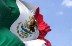 Mexican Flag waving in sky