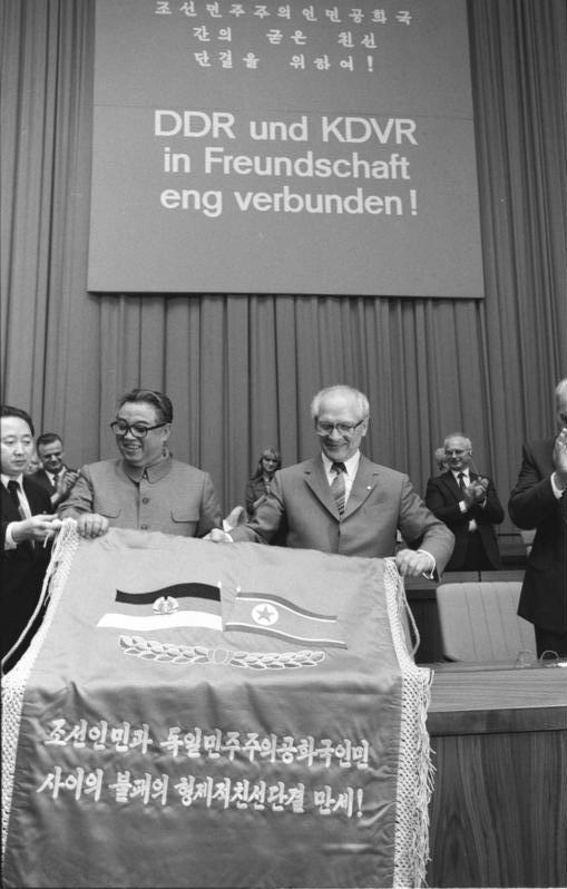 Image depicting Kim Il Sung standing side-by-side with Erich Honecker, during the North Korea leader's visit to East Germany. ( Bundesarchiv, Bild 183-1984-0601-046 / Mittelstädt, Rainer / CC-BY-SA 3.0) 