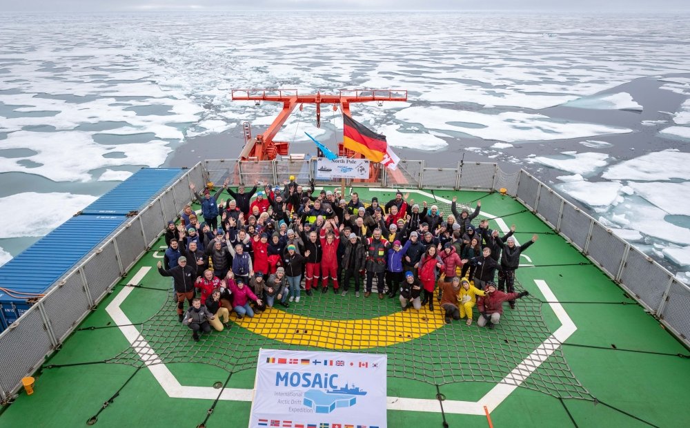 The MOSAiC crew and scientists gathered on the deck as Polarstern reached the North Pole.