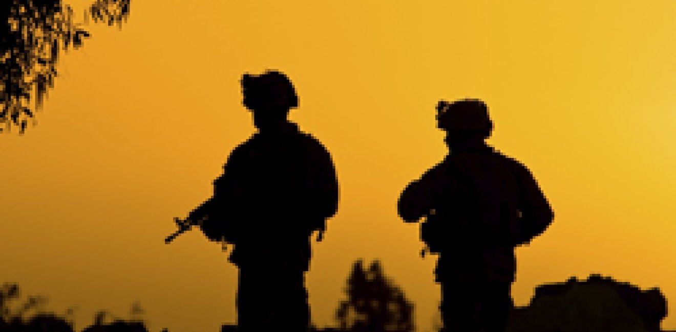Soldiers in front of a sunset