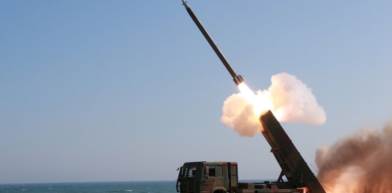 A rocket is launched during a demonstration of a new large-caliber multiple rocket launching system attended by North Korean leader Kim Jong Un (not pictured) at an unknown location, in this undated file photo released by North Korea's Korean Central News Agency (KCNA) on March 22, 2016. 