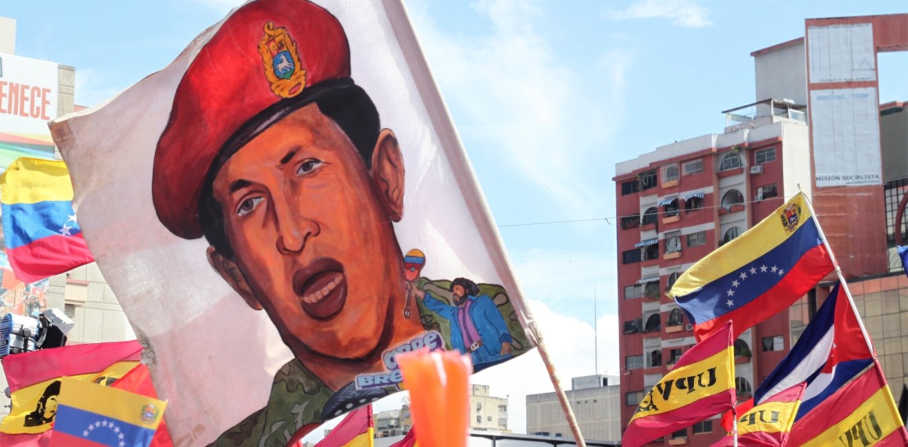 shutterstock_1034959132_-_chavez_flag_at_rally.jpg