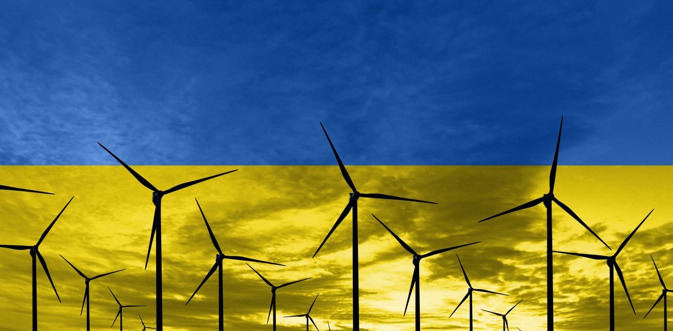 Ukrainian flag superimposed over wind turbines