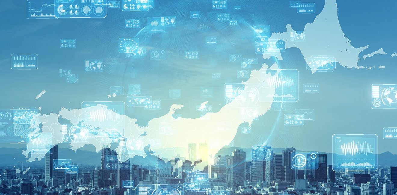 A map of Japan surrounded by screens with digital graphs and images