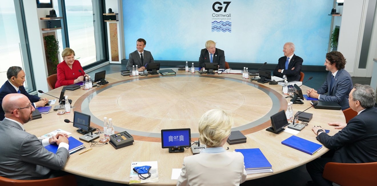 The leaders of the G7 countries sit around a round table.