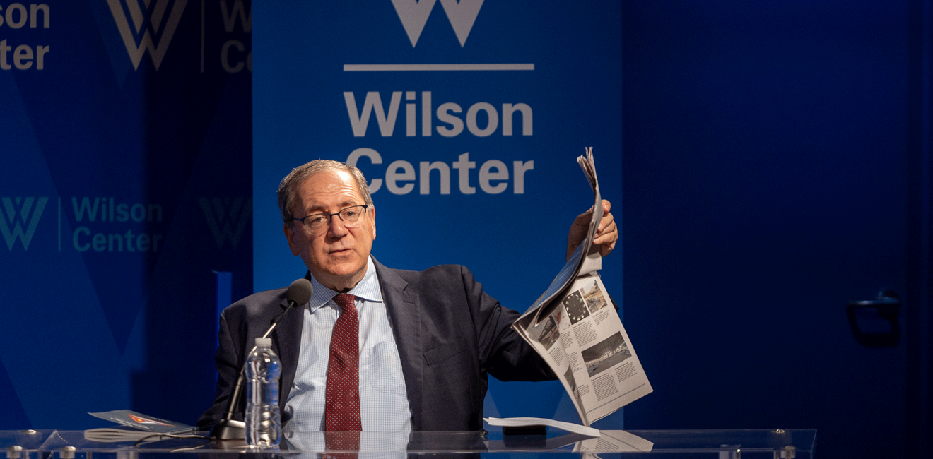 David Sanger holding up a newspaper