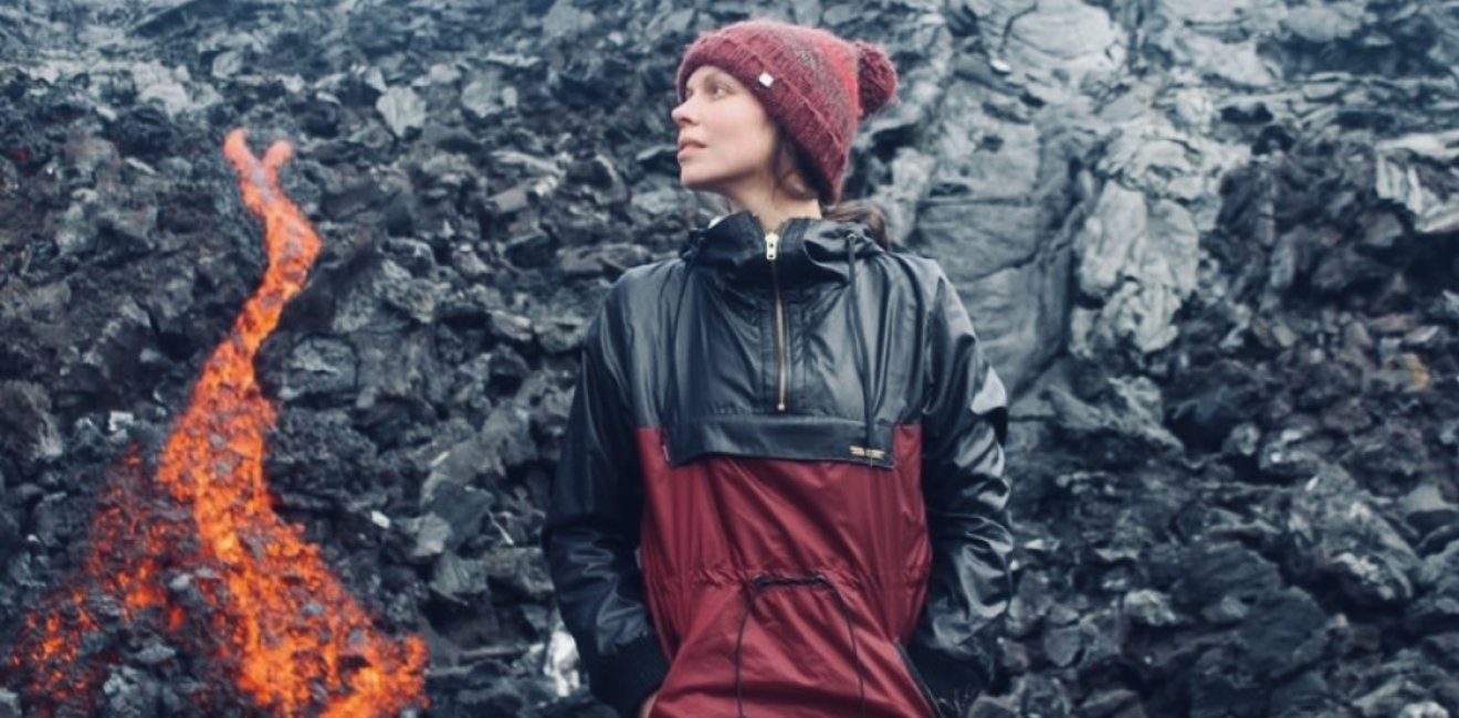 Person standing next to lava flow