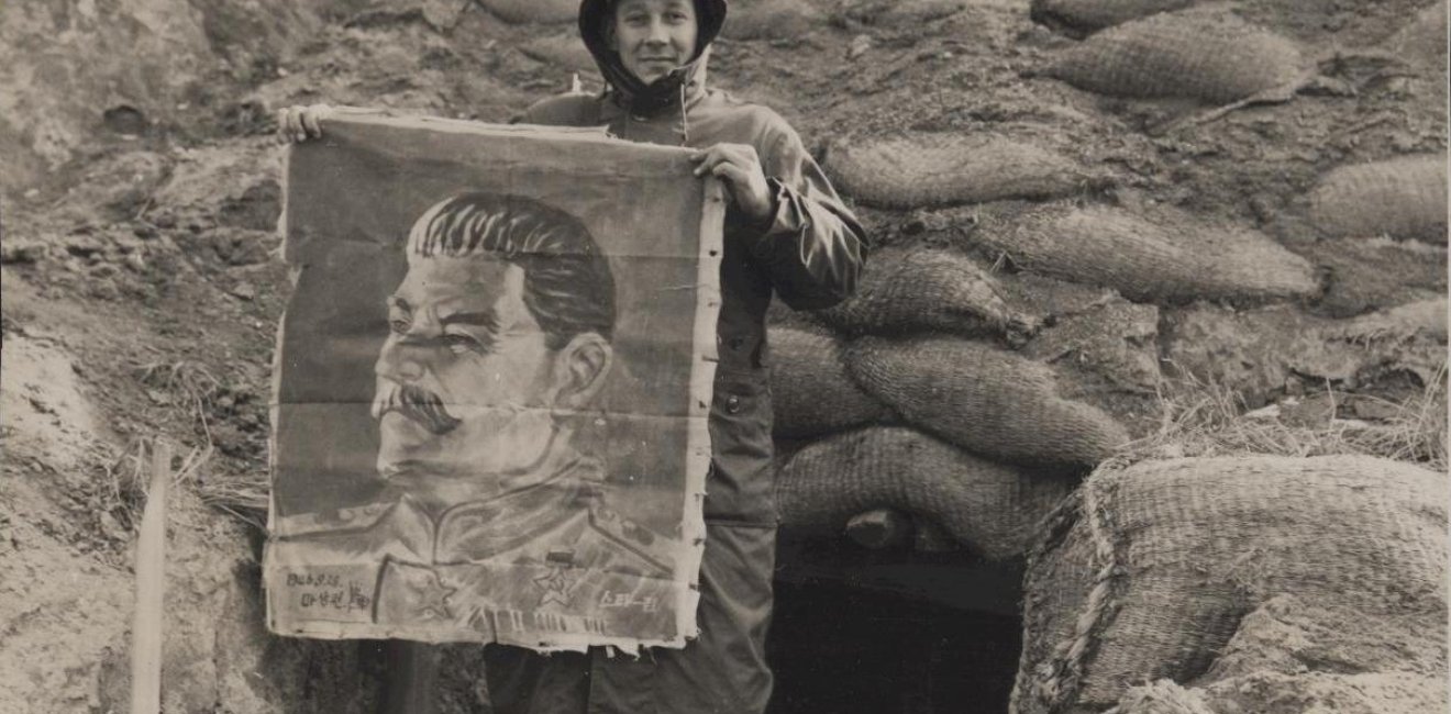 Marine with Image of Stalin Found in a Bunker, Yudam-ni, 27 November 1950