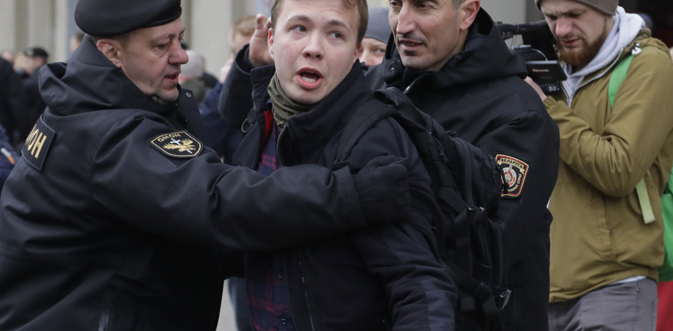 Belarus police detain journalist Roman Protasevich in Minsk, Belarus, Sunday, March 26, 2017. Dozens protestors were detained during attempt to rally in downtown Minsk. (AP Photo/Sergei Grits)