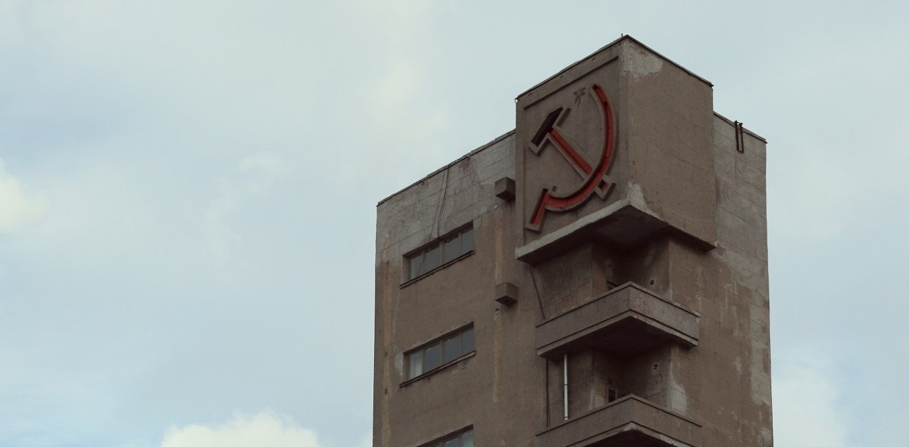 Sickle and hammer on a Soviet building