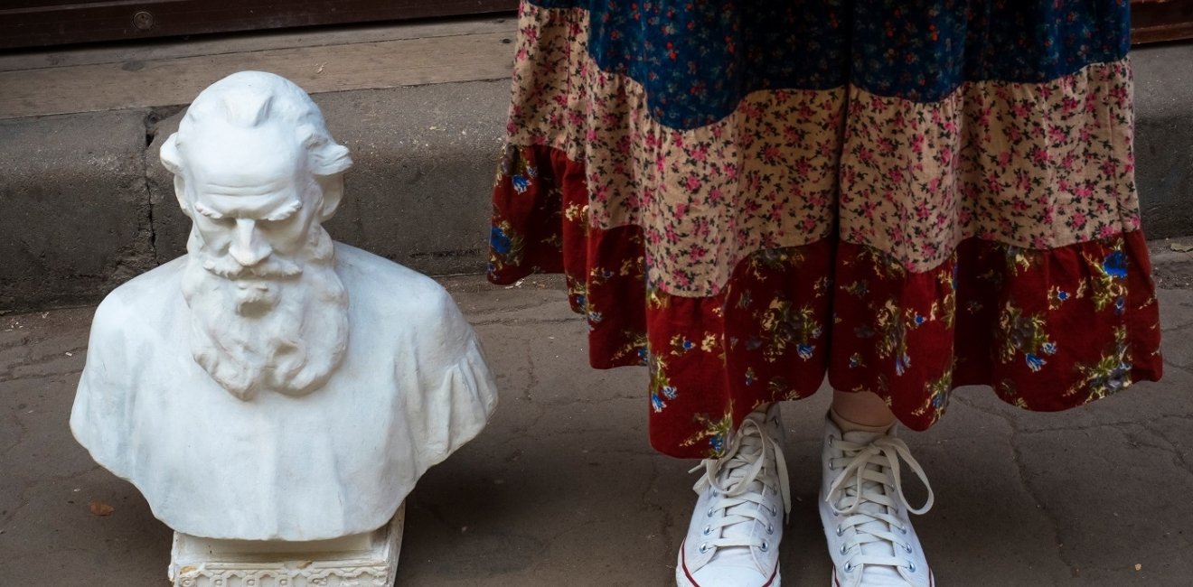 image of legs next to bust on ground 