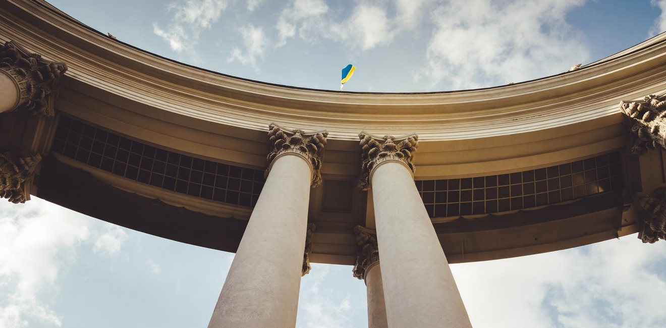 Portico of the building of the Ministry of Foreign Affairs. Ukraine flag flies on the arch of the Ministry of Foreign Affair. 
