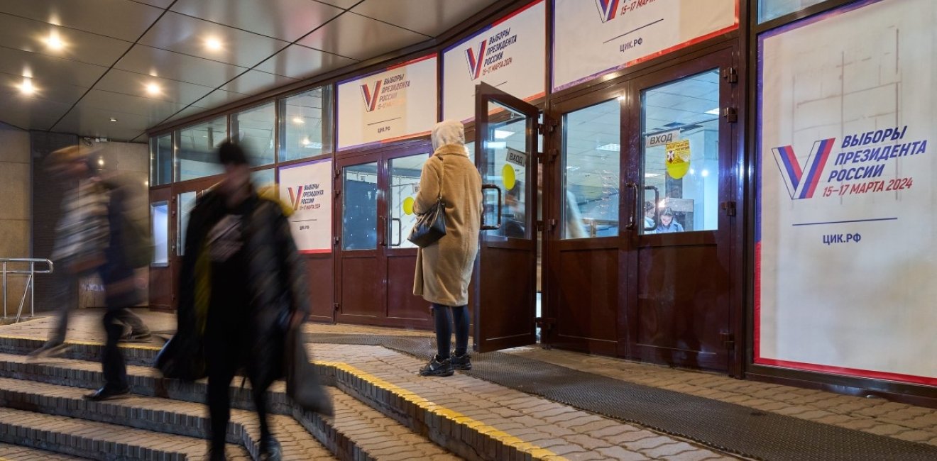 Posters of presidential elections decorate the entrance to the building of Vladivostok State University