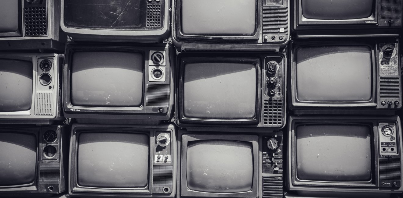 Stacked old TVs