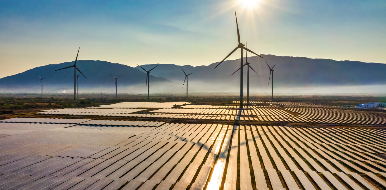 Aerial view of windmills and solar panels, courtesy of Nguyen Quang Ngoc Tonkin/Shutterstock.com.