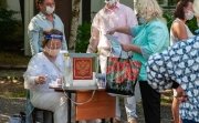 In Petrozavodsk, Russia, voting continues on the adoption of amendments to the Constitution. Part of the voting takes place at improvised street polling stations, with poll workers wearing masks.