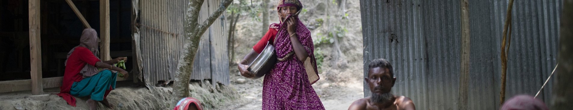 Bangladesh villagers sitting on ground