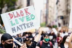 Protests in New York. People with protesting posters marching protest over George Floyd death. Black lives matter movement in New York. 
