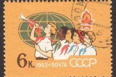  CIRCA NOVEMBER 2018: a post stamp printed in the USSR shows Pioneers of Different Peoples, Globe, the series "The 40th Anniversary of All-Union Lenin Pioneer Organization", circa 1962