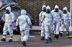 People in hazmat suits clean up the site of the poisoning of Sergei Skripal in Salisbury