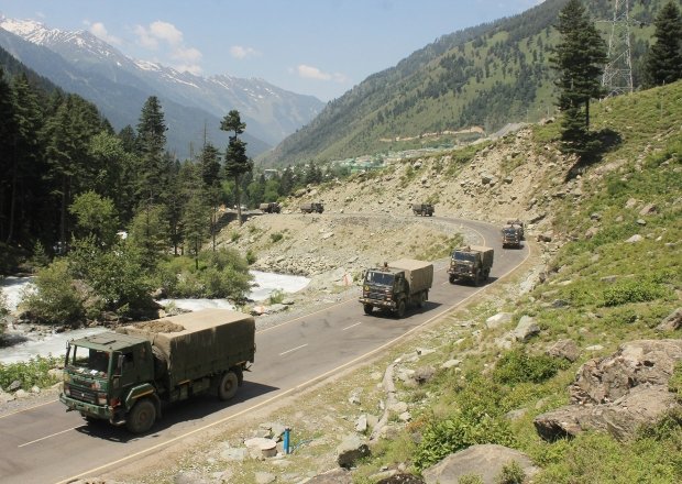 An Indian army convoy of trucks moving along the Srinagar-Ladakh highway.