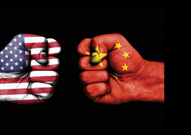 US and China flags on fists
