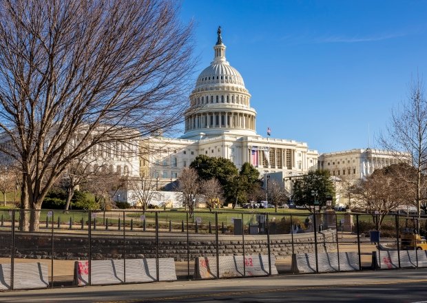 Capitol building behind barricades