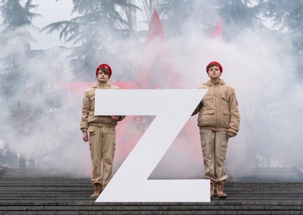 Soldiers standing with a large Z