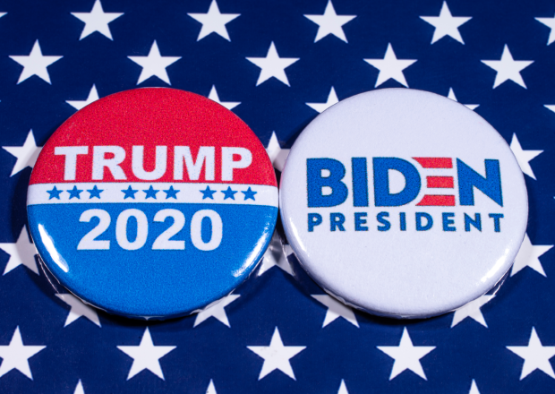 Donald Trump and Joe Biden pin badges, pictured of the USA flag. The two men will be battling eachother in the 2020 US Presidential Election.