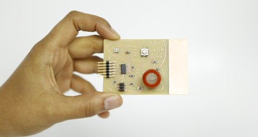 Hand holding up an air sensor