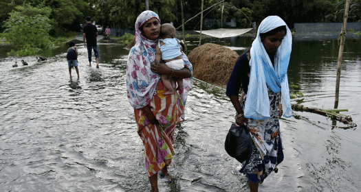 Women walking in flood