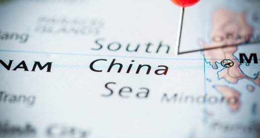 Map of the South China Sea with a red pin pointing to it.