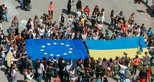 Crowd holding EU and Ukrainian Flag