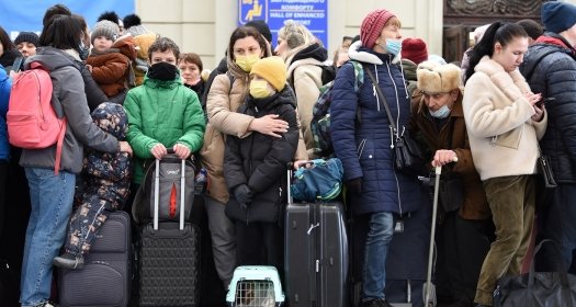 Lviv, Ukraine - February 26, 2022. People in railway station of western Ukrainian city of Lviv waiting for the train to Poland.