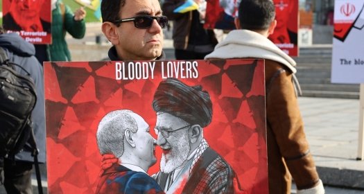 Kyiv, Ukraine - 28 October 2022: Iranian man with political banner in hands protests against dictatorship and ayatollah regime in Iran at street rally. reportage editorial photo