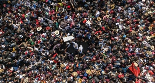 The president of Mexico Andres Manuel Lopez Obrador walking with hundreds of thousands of people towards the zocalo of Mexico City to render his fourth government report.
