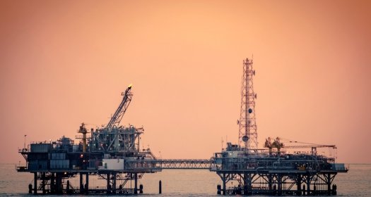 Oil platform silhouette in Gulf of Mexico
