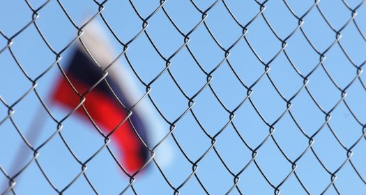 The Russian flag behind fence