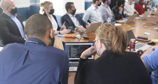 Two tech labs participants sharing a computer screen