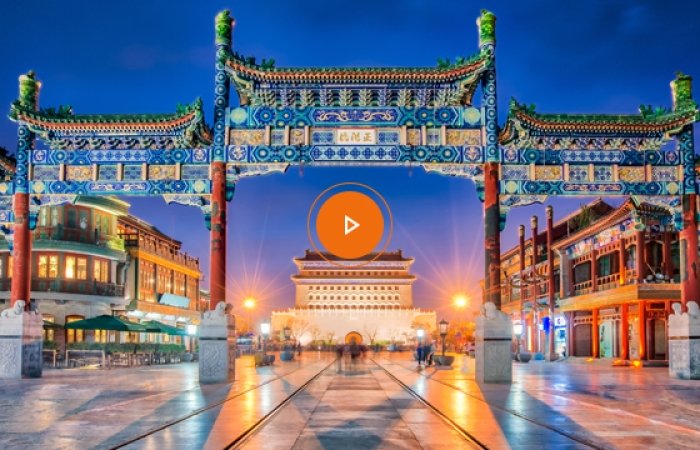An image of Beijing Zhengyang Gate with an orange play button on top.