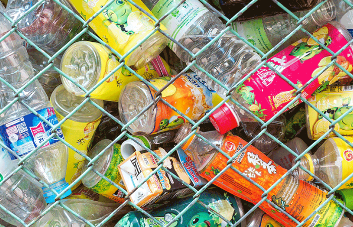 Plastic bottles behind a fence