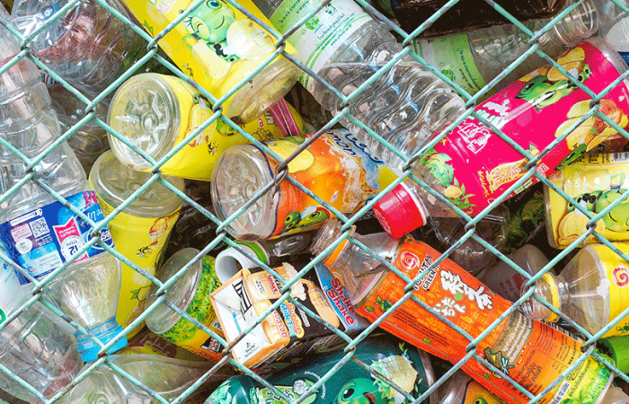  Plastic bottles behind a fence