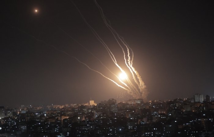 Smoke trails from rockets fired from Gaza at night