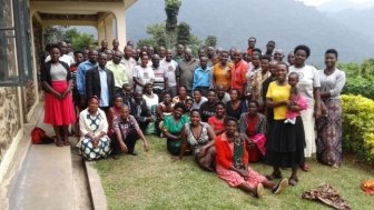 A group photo of Village Health and Conservation Teams after a training at the Gorilla Health and Community Conservation Center
